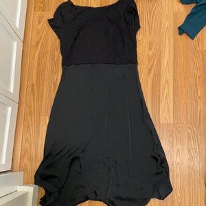 Cute black dress. Silk bottom. Cotton top. Never worn